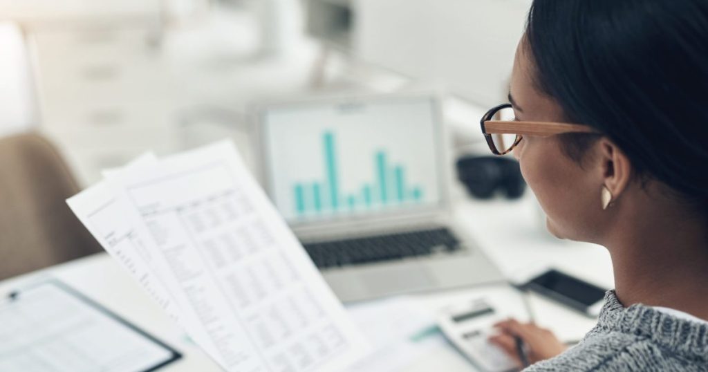 Business woman studying financial statements