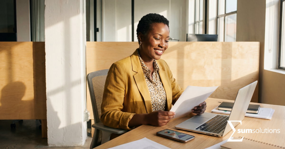 calm confident business owner reviewing finances at desk