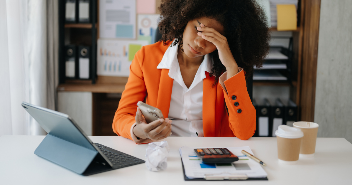 Stressed out business woman at her desk